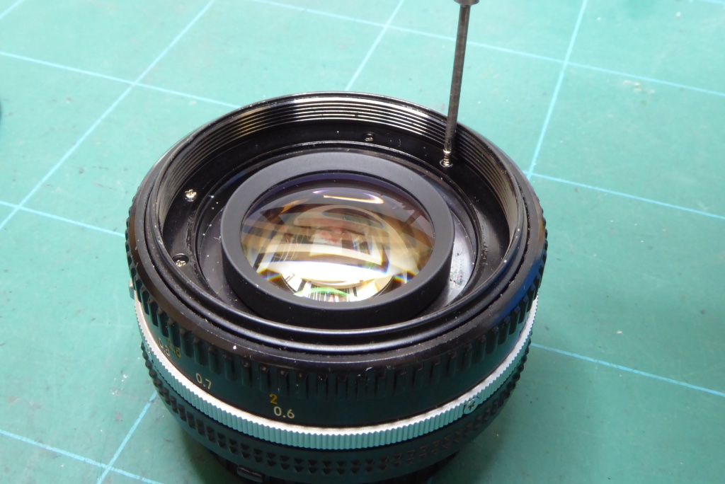 Nikon 50mm Repair Guide - The filter ring screws on the Nikon AiS and E series 50mm Lens