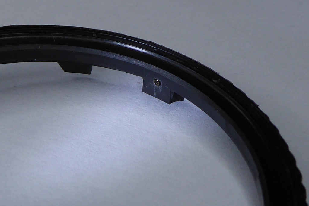 Replace the small spring in the aperture ring